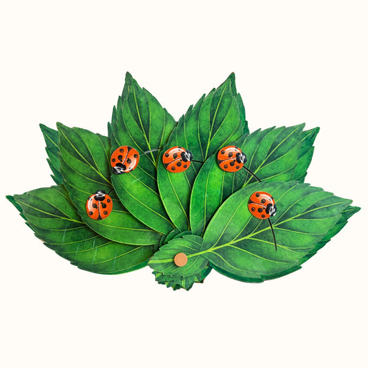 Lucky Charm Fan, a green sculptural folding fan with leaves and ladybugs.