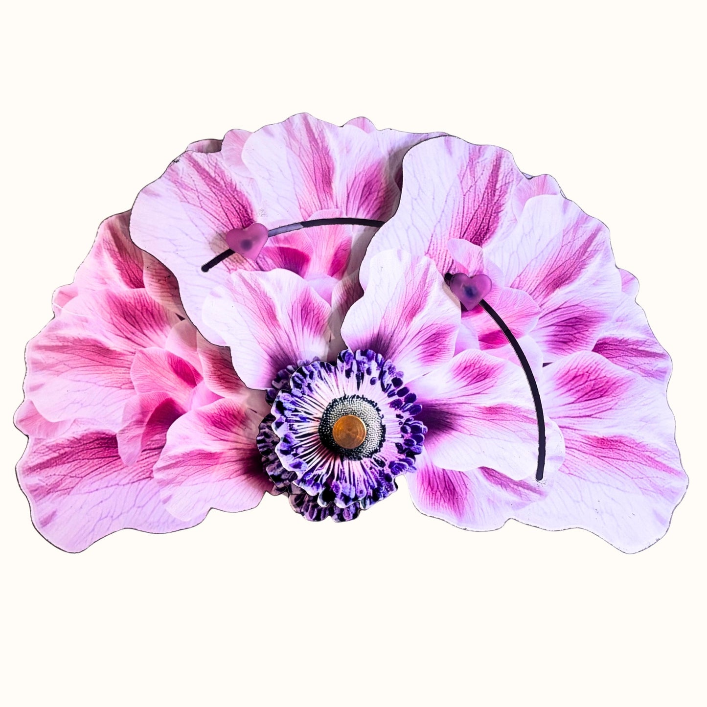 The Pink Anemone, a pink floral sculptural folding fan inspired by an anemone flower.