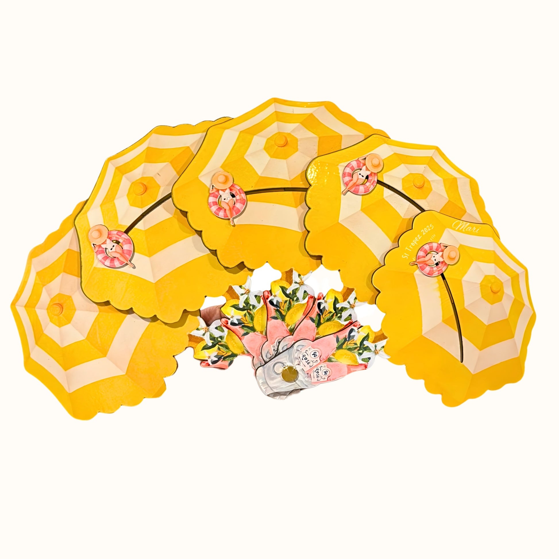 St. Tropez Fan, a yellow sculptural folding fan with beach umbrellas and summer details.