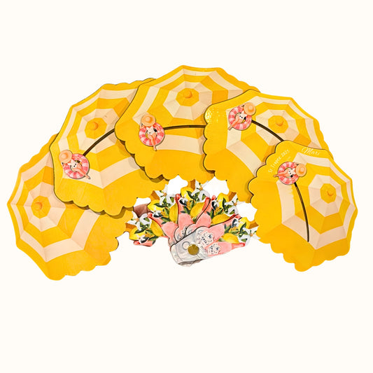 St. Tropez Fan, a yellow sculptural folding fan with beach umbrellas and summer details.